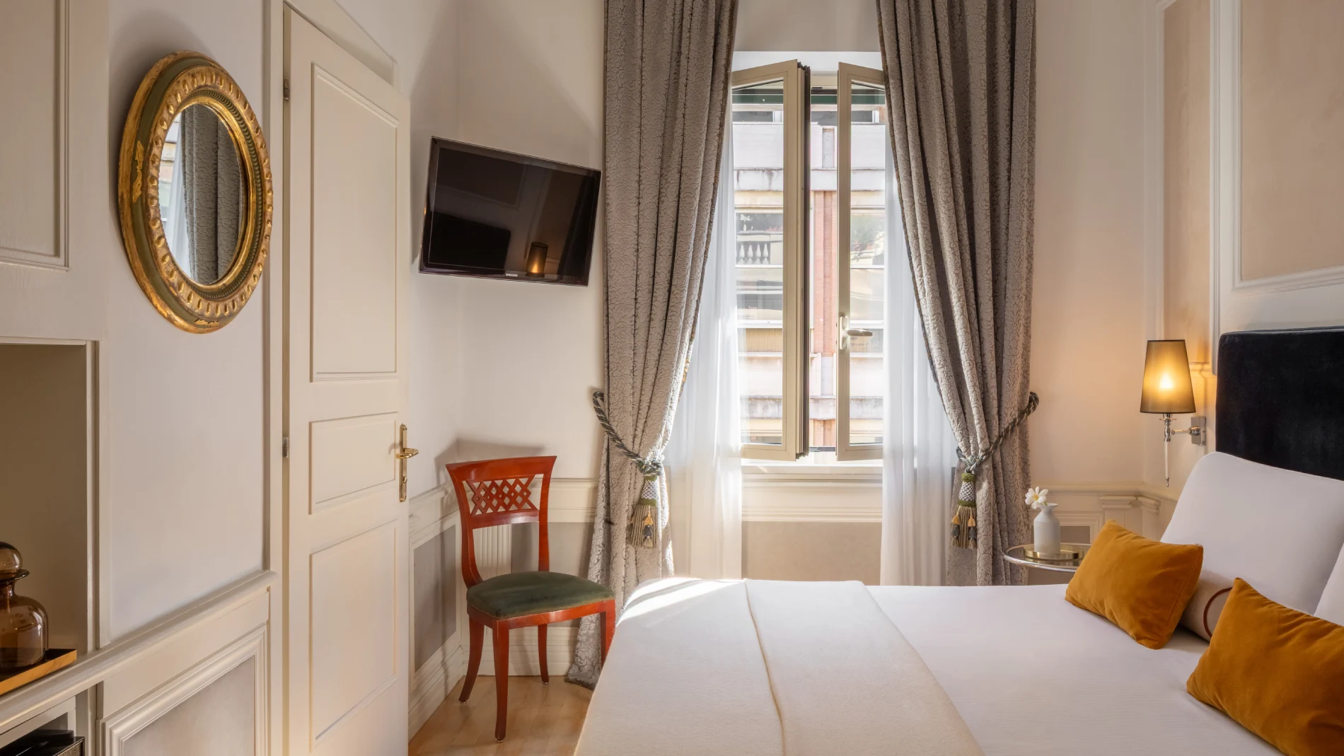 Bright room with bed, open window, damask curtains, TV and ochre cushions near the Rome Opera House - The Hotel Britannia, BZAR hotels in Rome