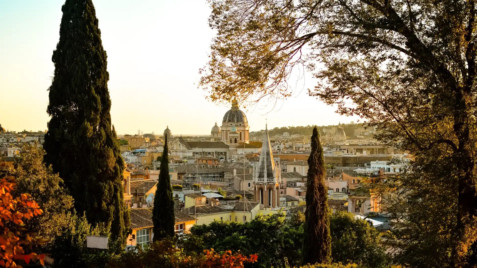 Rome sunset panorama with domes, bell towers, cypress trees and historic rooftops for a central stay - The Hotel Britannia, BZAR hotels in Rome