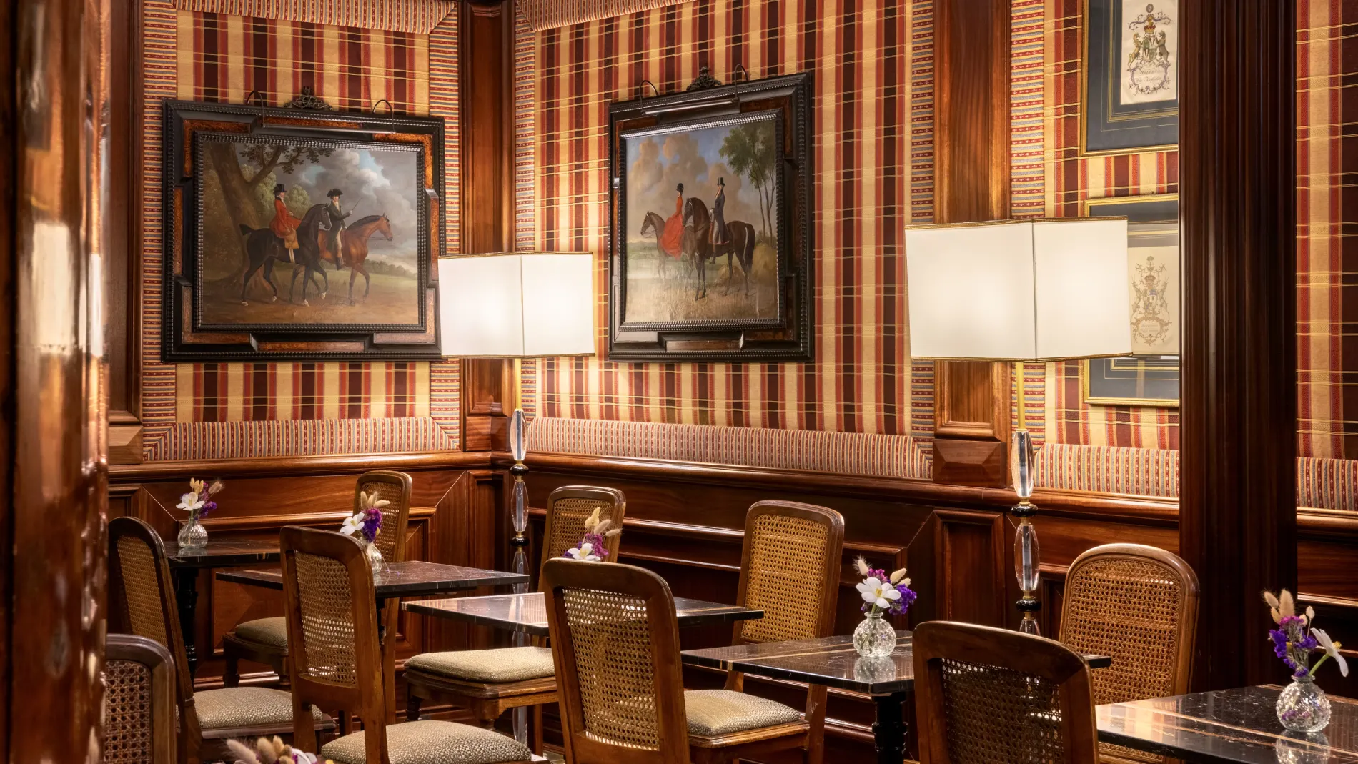 Lounge detail with equestrian paintings, tartan walls, lamps and marble tables in Rome - The Hotel Britannia, BZAR hotels in Rome