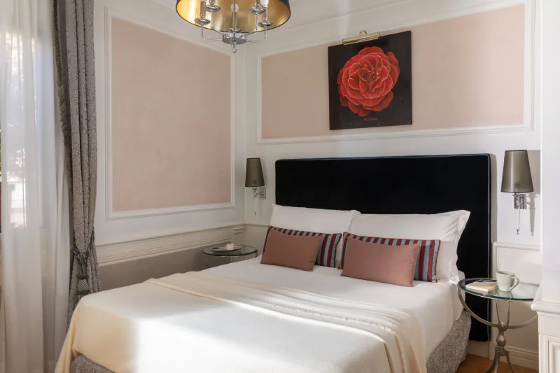 Cosy Small room with double bed, dark headboard, blush cushions and floral artwork in Rome - The Hotel Britannia, BZAR hotels in Rome